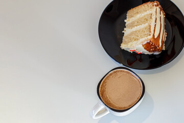 A cup of coffee and a piece of cake. Dessert.