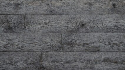 Naklejka premium Stylish gray hardwood panels with a matte finish showcasing a modern staggered design and prominent wood grain for interior decor