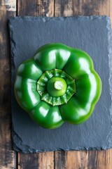 Vibrant Green Bell Pepper on Dark Slate Background