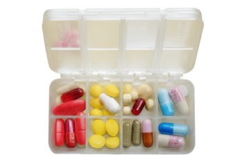A Colorful Array of Medication: Capsules and Tablets in a Pill Organizer, Providing a Visual Representation of Daily Health Management