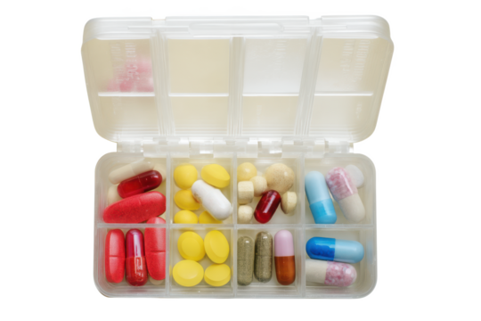 A Colorful Array of Medication: Capsules and Tablets in a Pill Organizer, Providing a Visual Representation of Daily Health Management