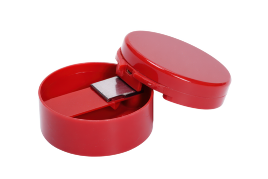 Crimson Container: A macro shot of a vibrant red, plastic container with a sliding, metallic component, offering a glimpse into a world of minimalist design and function.