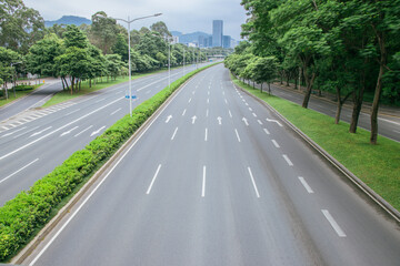 Empty Highway in a Lush Urban Landscape