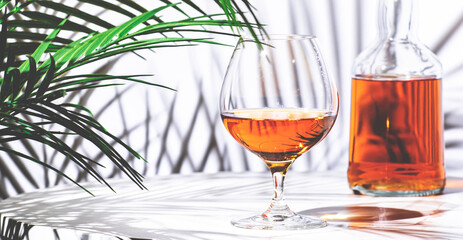 Spanish Brandy in glass with bottle on white background