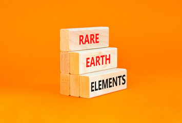Naklejka premium Rare earth elements symbol. Concept words Rare earth elements on beautiful wooden block. Beautiful orange table orange background. Business and rare earth elements concept. Copy space.