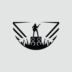 Silhouette of Guitarist Performing on Stage with Cheering Crowd