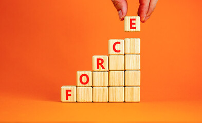 Force symbol. Concept word Force on beautiful wooden blocks. Beautiful orange table orange...