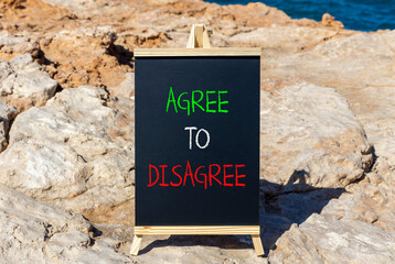 Agree to disagree symbol. Concept words Agree to disagree on beautiful blackboard. Beautiful brown...