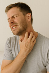 Obraz premium Man Scratching Itchy Neck