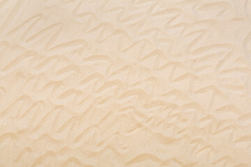 Textured beach sand as background, top view