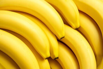Ripe yellow bananas showcasing smooth skin, clustered together with natural golden hue and uniform curvature