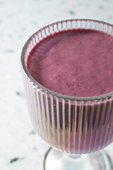 A closeup view of a blended berry smoothie.