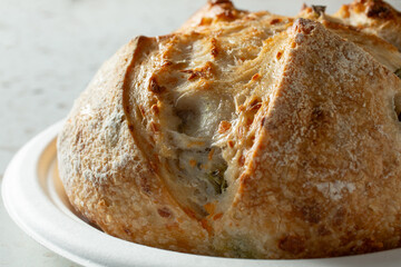 A closeup view of a rustic sourdough boule.