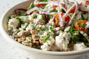 A closeup view of a Mediterranean chicken bowl.