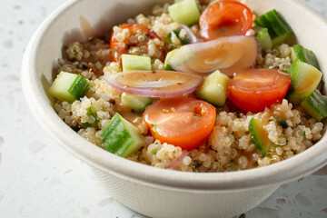 A closeup view of a quinoa salad bowl.
