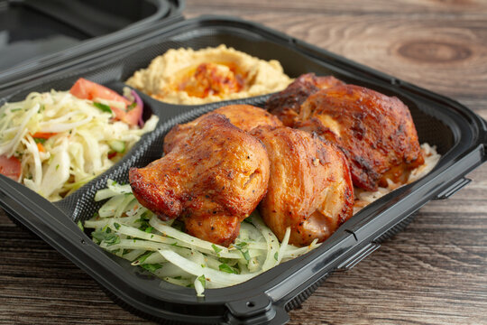 A closeup view of a chicken thigh combo plate.