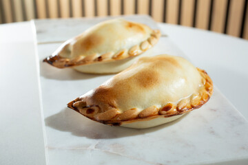A closeup view of some empanadas.
