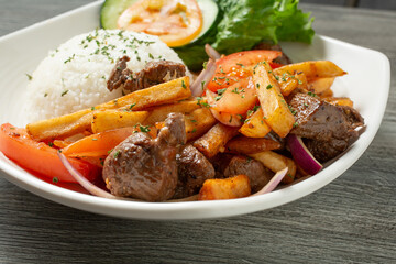 A view of a plate of lomo saltado.