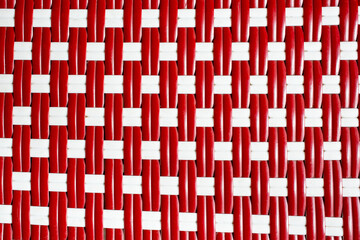 A top down view of a rattan style weave material, as a background.
