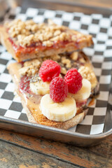 A view of a peanut butter and jelly tartine.