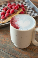 A view of a butterfly latte, with some hazelnut chocolate toast.