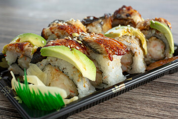 A closeup view of a dragon sushi roll.