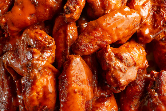 A top down view of a pile of Buffalo wings, as a background.