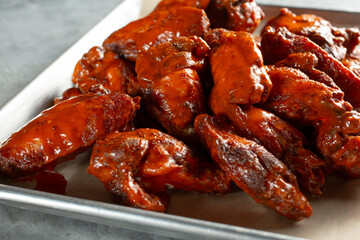 A view of a tray full of Buffalo wings.