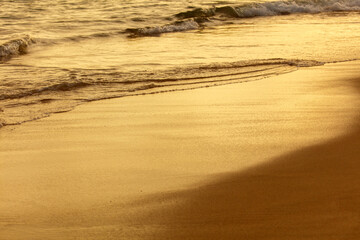 The beach is a beautiful golden color