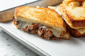 A closeup view of a brisket melt.
