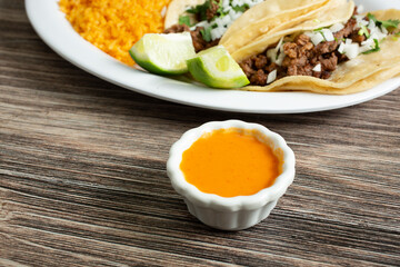 A view of a condiment cup of habanero salsa.