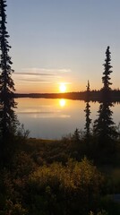 Scenic Sunset over Calm Lake with Trees