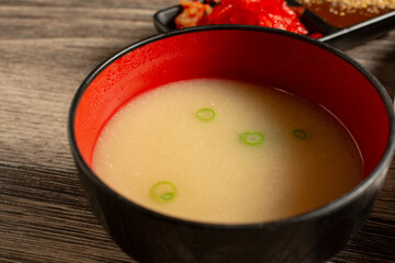 A closeup view of a bowl of miso soup.