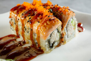 A closeup view of a baked salmon roll. © DAVID