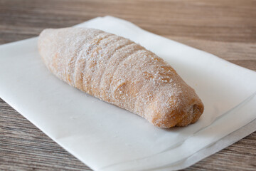 A closeup view of an elote pan dulce.