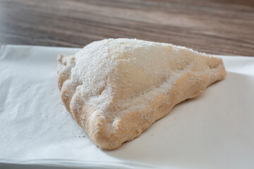 A closeup view of an empanada de crema.