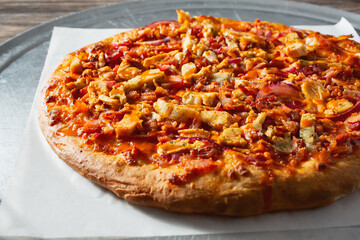 A closeup view of a Buffalo chicken pizza.