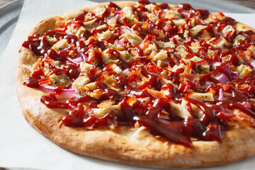 A closeup view of a BBQ chicken pizza.