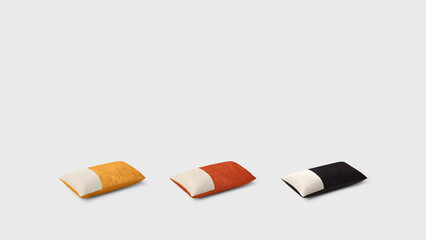 Three dual-colored pillows on copy-space background.