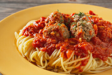 A closeup view of spaghetti and meatballs.