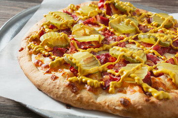 A view of a pastrami pizza.