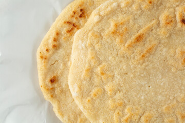A top down of a stack of pupusas.