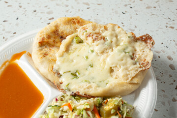 A view of some loroco pupusas.