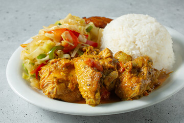 A closeup view of a plate of curry chicken.