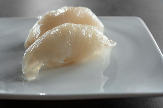 A closeup view of kanpachi nigiri.