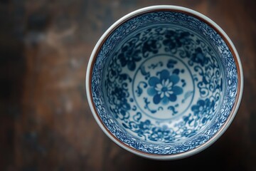 Closeup of blue and white porcelain bowl with intricate floral pattern