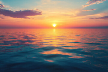 Obraz premium Sunset over the ocean with dramatic clouds reflecting vibrant colors on the water.