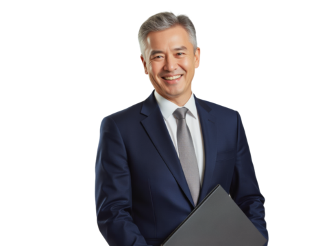 Business portrait isolated on white transparent background: A mature Asian man in a navy suit and tie confidently smiles while holding a laptop, exuding professionalism against a neutral background.