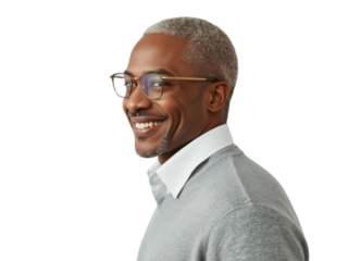 Business portrait isolated on white transparent background: A mature Black man with silver hair smiles confidently while wearing glasses and a sweater, set against a plain white background.
