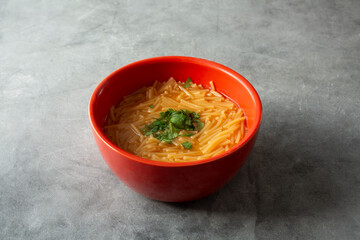 A view of a bowl of Mexican fideo soup.